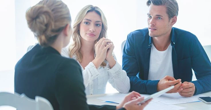 Protect What Matters Most: Joint Tenancy for Married Couples in Maryland Maryland couple meeting with a financial advisor to review joint tenancy and estate planning options before home purchase.