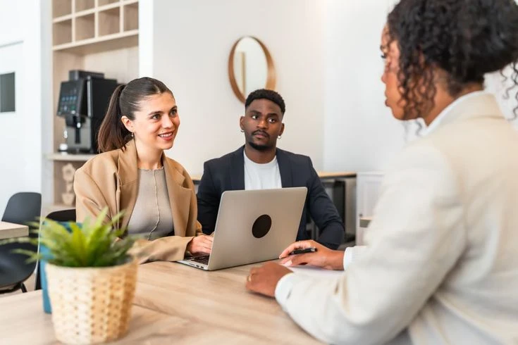 financial advisor consulting with Maryland family on life insurance and IUL coverage