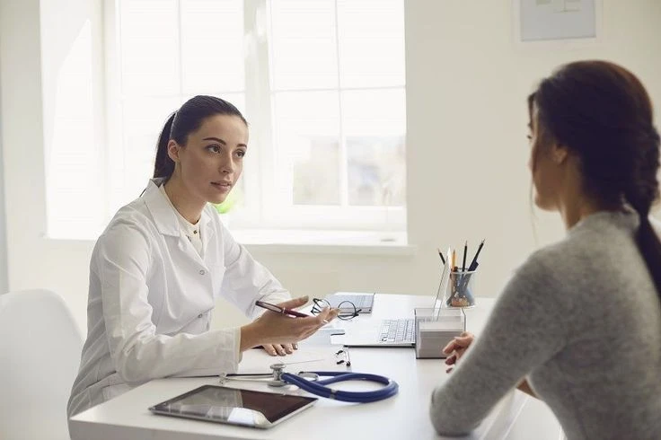 How to use Critical Illness Insurance(Avoid Summer Health Scare Emergency) doctor consulting with a patient in a clinical setting