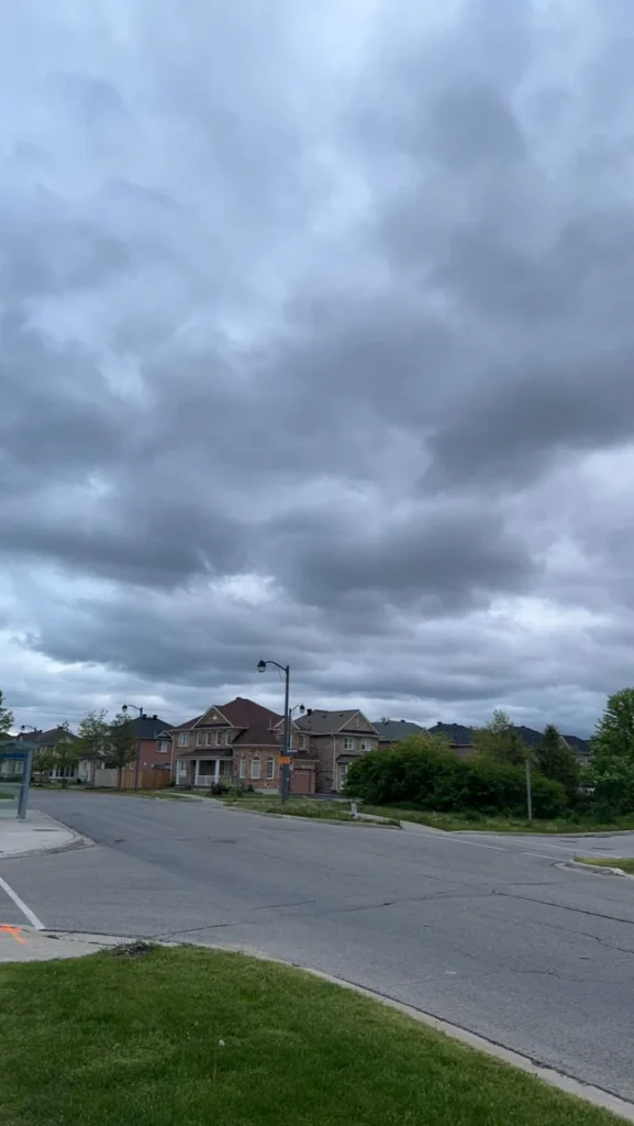 The Urgent MPI Hurricane Season Guide You Must Know Immediately storm clouds over suburban house