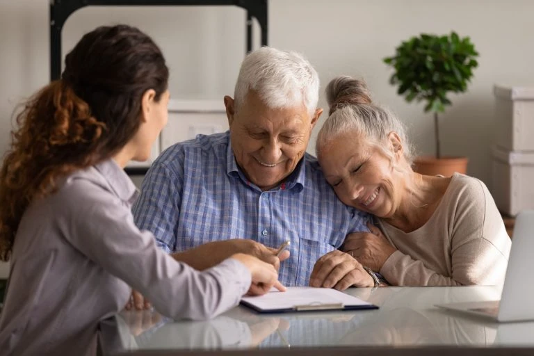 Power of Attorney Explained: The Document People Confuse With a Will A financial professional reviewing a power of attorney document with a client as part of an estate planning consultation.