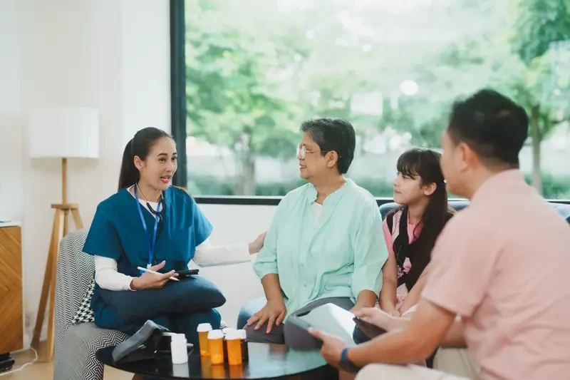 Power of Attorney Explained: The Document People Confuse With a Will A healthcare provider speaking with a patient and a family member, representing the role of a healthcare power of attorney agent in making medical decisions when the principal cannot communicate.