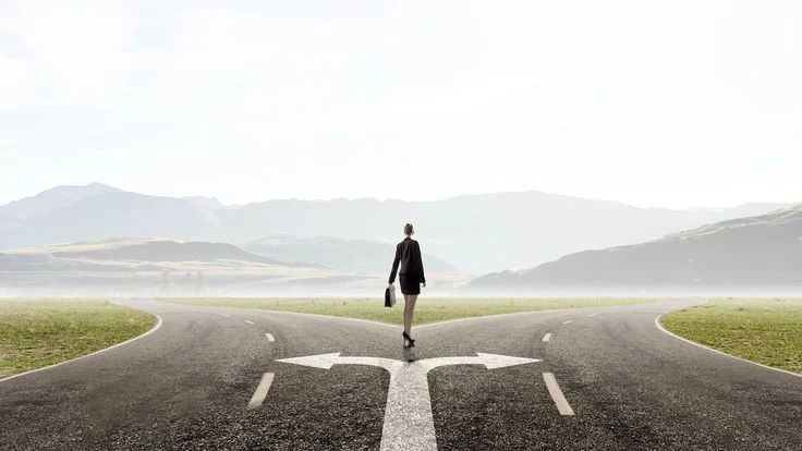 Positive Arbitrage in Action: How IUL Loans Grow Your Money Even While You’re Using It Two diverging paths representing the choice between participating and non-participating IUL loan structures.