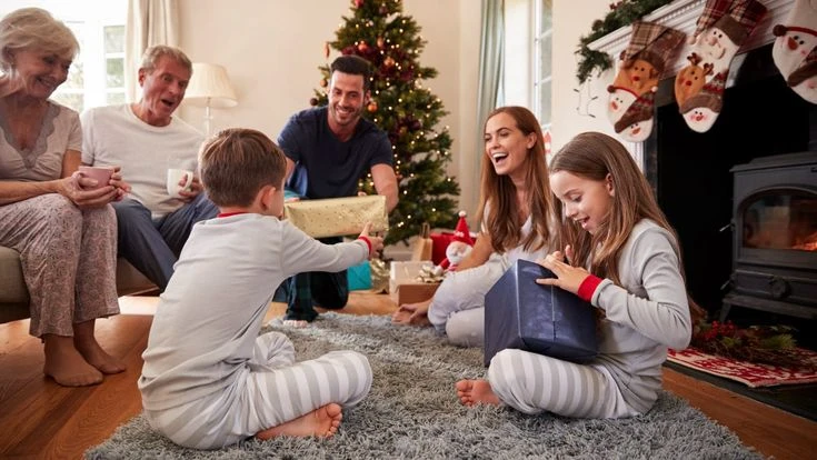 The Best Christmas Gifts a Parent Can Give in 2026 family christmas gifts in warm living room