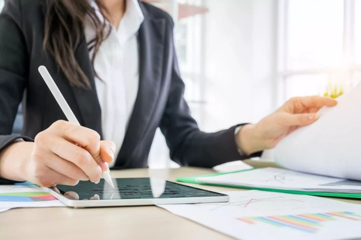 A financial professional reviewing a financial toolbox breakdown